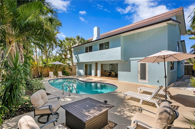 221 42nd Ave, St Pete Beach, FL 33706 - view of swimming pool featuring a fenced backyard and a patio
