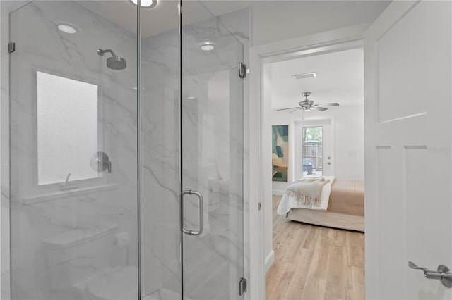 221 42nd Ave, St Pete Beach, FL 33706 - ensuite bathroom featuring a marble finish shower, wood finished floors, and ceiling fan