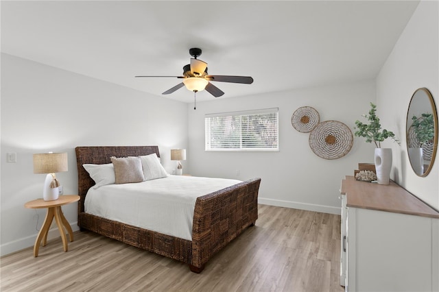 221 42nd Ave, St Pete Beach, FL 33706 - bedroom featuring light wood-style flooring and a ceiling fan