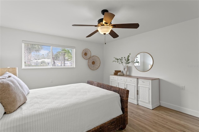 221 42nd Ave, St Pete Beach, FL 33706 - bedroom featuring light wood-type flooring and ceiling fan
