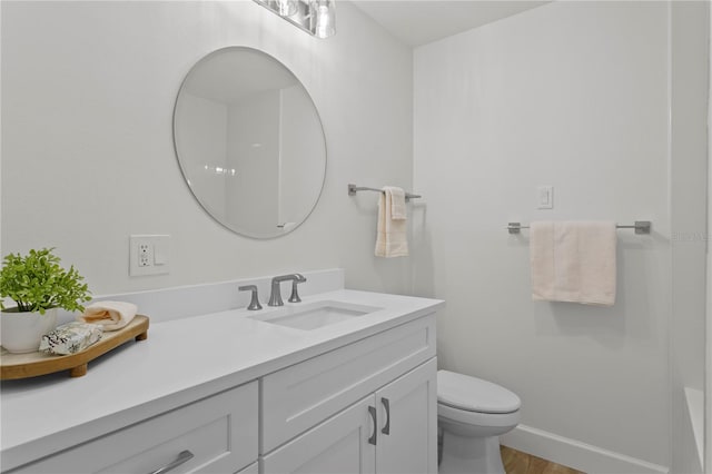 221 42nd Ave, St Pete Beach, FL 33706 - bathroom featuring vanity and wood finished floors
