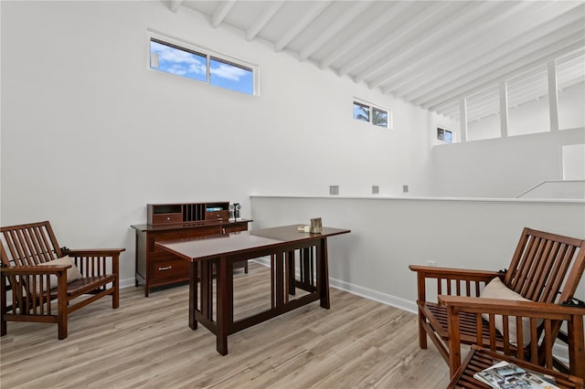 221 42nd Ave, St Pete Beach, FL 33706 - office space with beamed ceiling, plenty of natural light, light wood-style floors, and a high ceiling