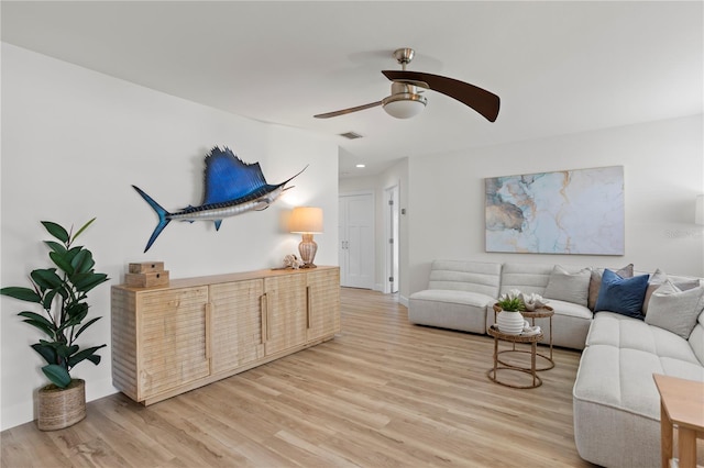 221 42nd Ave, St Pete Beach, FL 33706 - living area with a ceiling fan and light wood-style floors