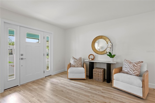 221 42nd Ave, St Pete Beach, FL 33706 - entrance foyer featuring light wood-type flooring and baseboards