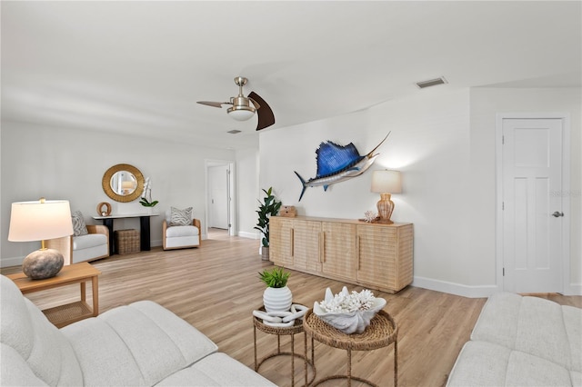 221 42nd Ave, St Pete Beach, FL 33706 - living area with ceiling fan and light wood-type flooring