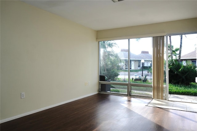 4329 Tahitian Gardens Cir Unit B, Holiday, FL 34691 - spare room featuring wood finished floors and baseboards