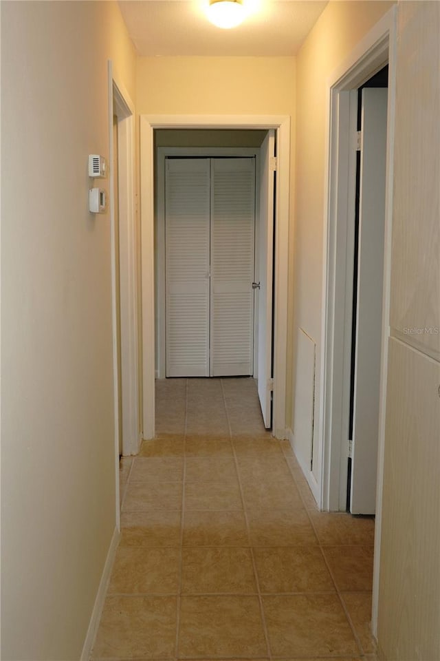 4329 Tahitian Gardens Cir Unit B, Holiday, FL 34691 - hallway with light tile patterned floors
