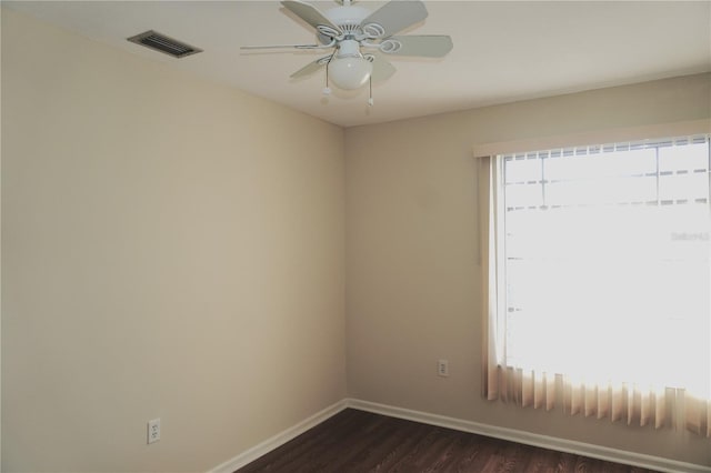 4329 Tahitian Gardens Cir Unit B, Holiday, FL 34691 - spare room with dark wood-style floors and a ceiling fan