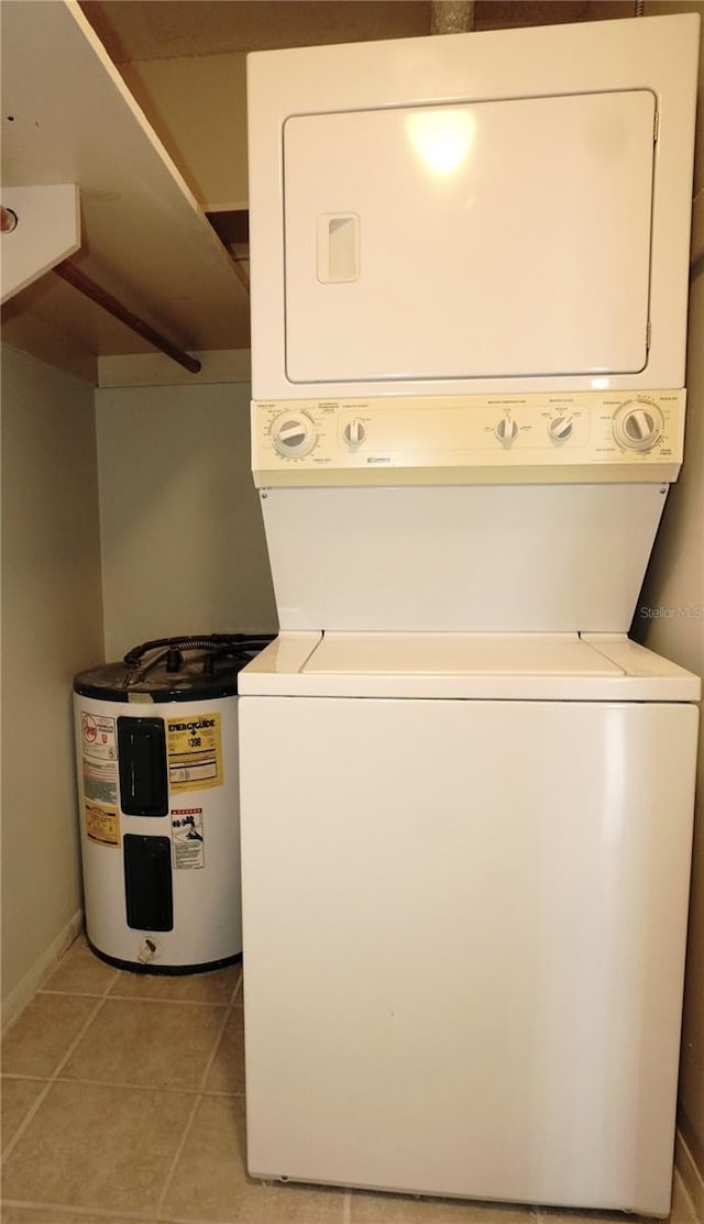 4329 Tahitian Gardens Cir Unit B, Holiday, FL 34691 - laundry room with stacked washer / dryer, electric water heater, and light tile patterned floors