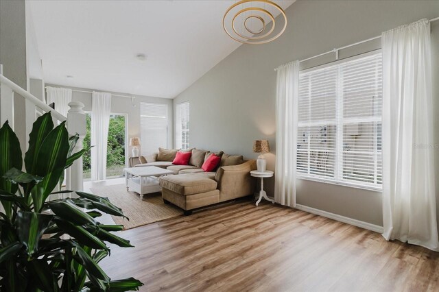 6260 Olivedale Dr, Riverview, FL 33578 - living area featuring light wood-type flooring and vaulted ceiling