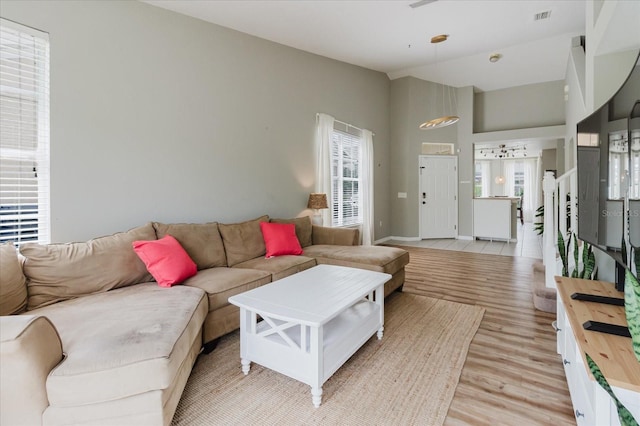 6260 Olivedale Dr, Riverview, FL 33578 - living area with light wood finished floors and high vaulted ceiling