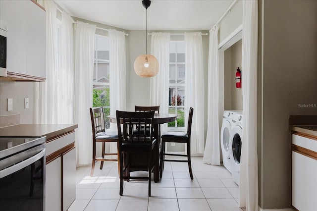 6260 Olivedale Dr, Riverview, FL 33578 - dining space with washer and dryer and light tile patterned flooring