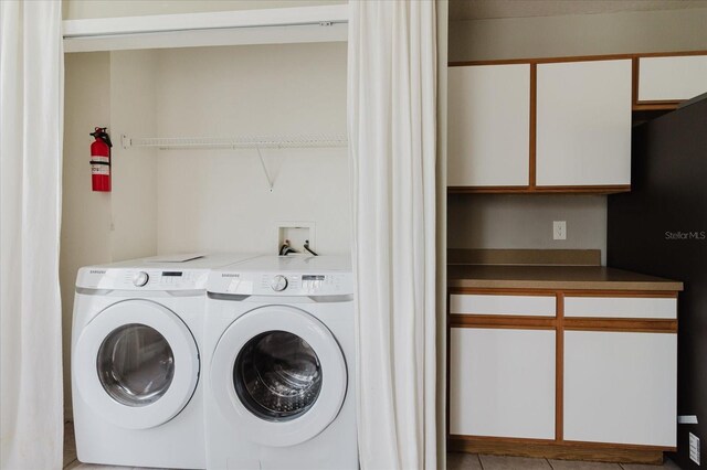 6260 Olivedale Dr, Riverview, FL 33578 - washroom featuring separate washer and dryer and tile patterned floors
