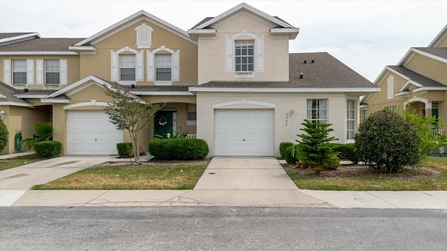 6260 Olivedale Dr, Riverview, FL 33578 - view of property featuring stucco siding, an attached garage, driveway, and roof with shingles