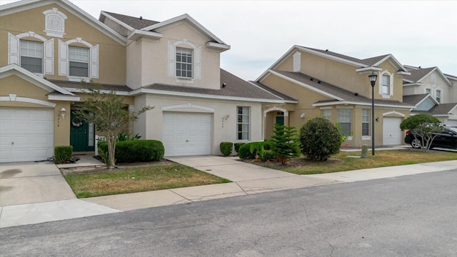 6260 Olivedale Dr, Riverview, FL 33578 - view of property featuring stucco siding, roof with shingles, concrete driveway, and an attached garage