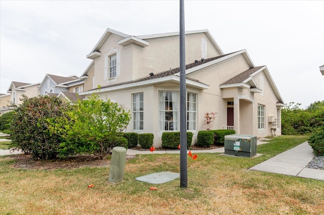 6260 Olivedale Dr, Riverview, FL 33578 - view of front of house featuring stucco siding and a front lawn