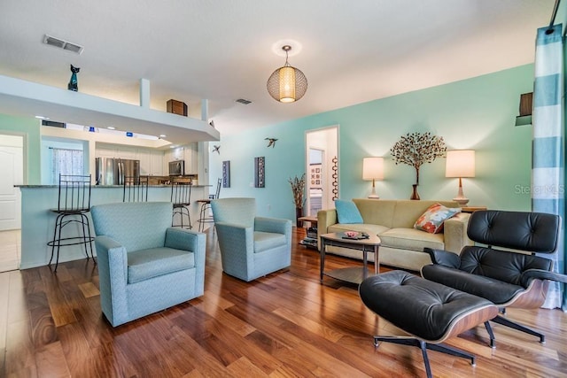 1140 S Pointe Alexis Dr, Tarpon Springs, FL 34689 - living room featuring wood finished floors