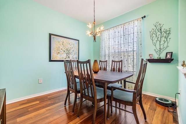 1140 S Pointe Alexis Dr, Tarpon Springs, FL 34689 - dining room featuring a chandelier and wood finished floors