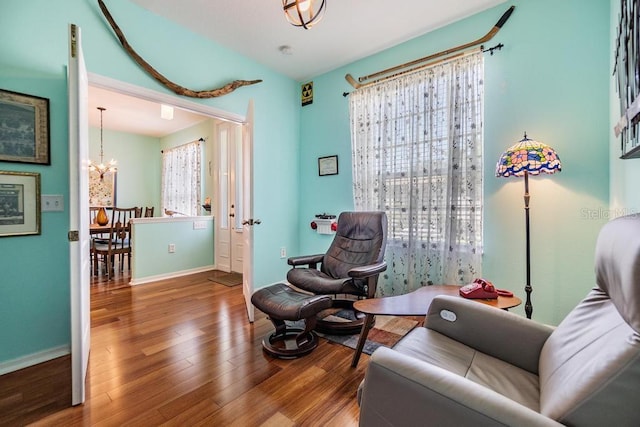 1140 S Pointe Alexis Dr, Tarpon Springs, FL 34689 - sitting room featuring a chandelier and wood finished floors