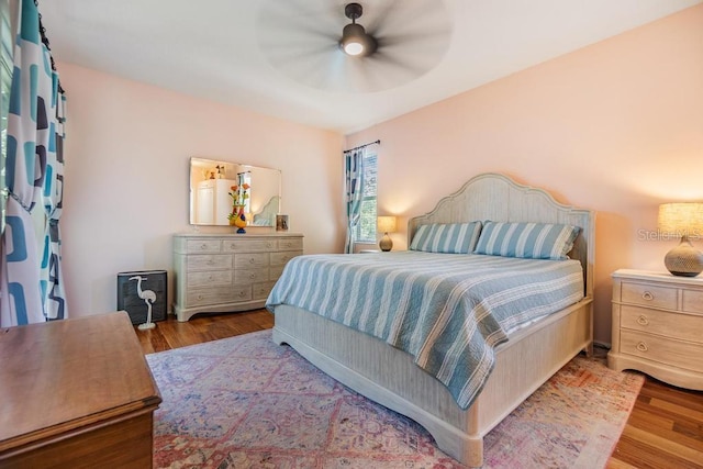 1140 S Pointe Alexis Dr, Tarpon Springs, FL 34689 - bedroom featuring wood finished floors and ceiling fan