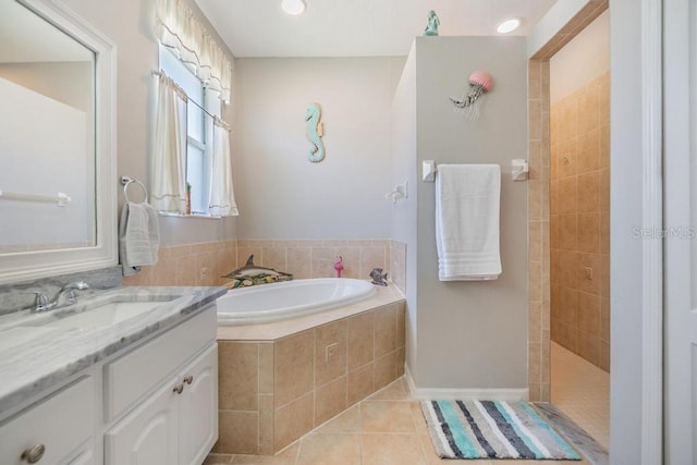 1140 S Pointe Alexis Dr, Tarpon Springs, FL 34689 - full bathroom with a bath, tile patterned flooring, vanity, a walk in shower, and recessed lighting