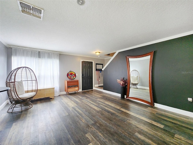 3112 Kearns Rd, Mulberry, FL 33860 - sitting room featuring a textured ceiling, ornamental molding, and wood finished floors