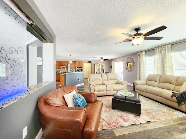 3112 Kearns Rd, Mulberry, FL 33860 - living room featuring a ceiling fan, wood finished floors, and a textured ceiling