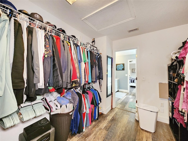 3112 Kearns Rd, Mulberry, FL 33860 - spacious closet featuring attic access and wood finished floors