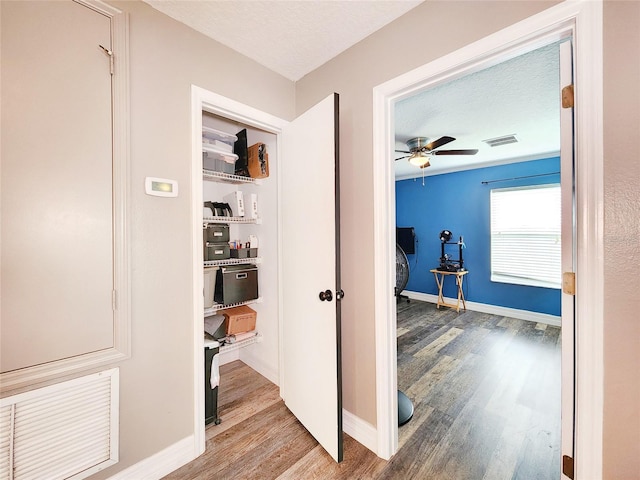 3112 Kearns Rd, Mulberry, FL 33860 - corridor with wood finished floors and a textured ceiling