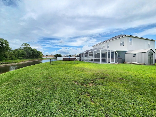 3112 Kearns Rd, Mulberry, FL 33860 - view of grassy yard with a shed, a water view, and a lanai