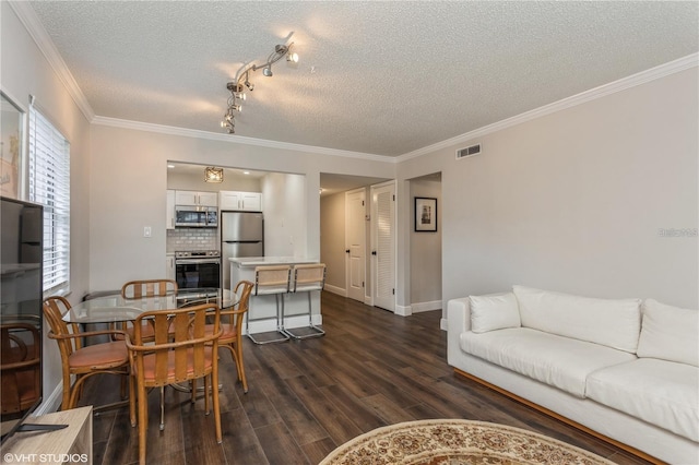 2207 S Carolina Ave Unit 10, Tampa, FL 33629 - living room with dark wood-type flooring, a textured ceiling, and crown molding