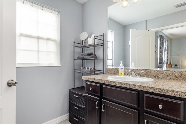 255 Annabelle Way, Davenport, FL 33837 - bathroom featuring vanity and healthy amount of natural light