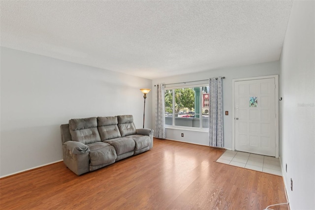2370 Jamaican St Unit 44, Clearwater, FL 33763 - living room featuring a textured ceiling and wood finished floors