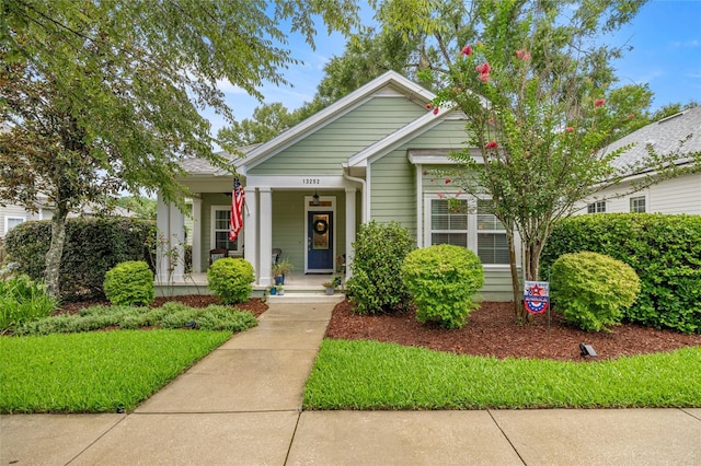 13252 SW 6th Ave, Newberry, FL 32669 - bungalow-style house featuring a porch