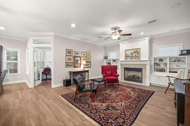 13252 SW 6th Ave, Newberry, FL 32669 - living area featuring light wood-style floors, healthy amount of natural light, recessed lighting, and crown molding