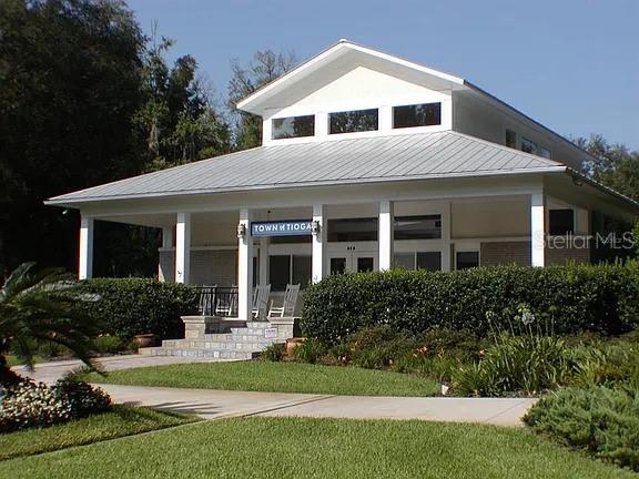 13252 SW 6th Ave, Newberry, FL 32669 - view of front of property with covered porch, a metal roof, and a standing seam roof
