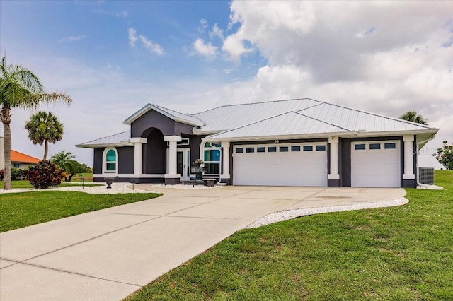 20 Bunker Ter, Rotonda West, FL 33947 - ranch-style home featuring concrete driveway, a front lawn, a garage, a metal roof, and stucco siding