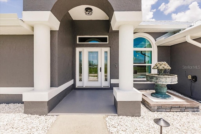 20 Bunker Ter, Rotonda West, FL 33947 - property entrance featuring stucco siding