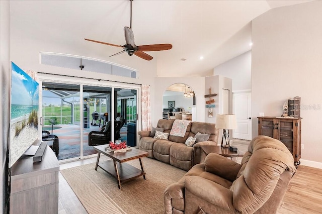 20 Bunker Ter, Rotonda West, FL 33947 - living area featuring ceiling fan, light wood finished floors, arched walkways, high vaulted ceiling, and recessed lighting