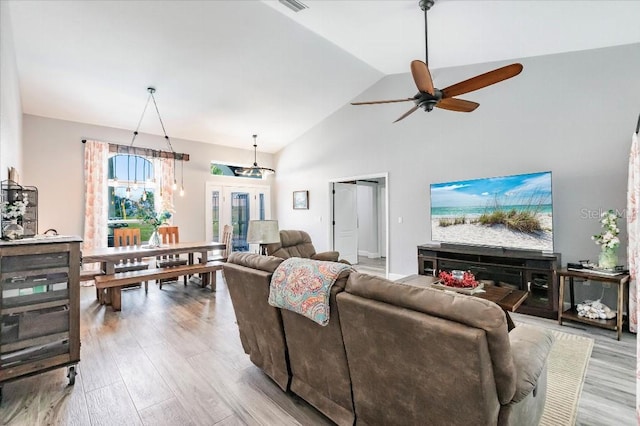 20 Bunker Ter, Rotonda West, FL 33947 - living room with ceiling fan, wood finished floors, and high vaulted ceiling