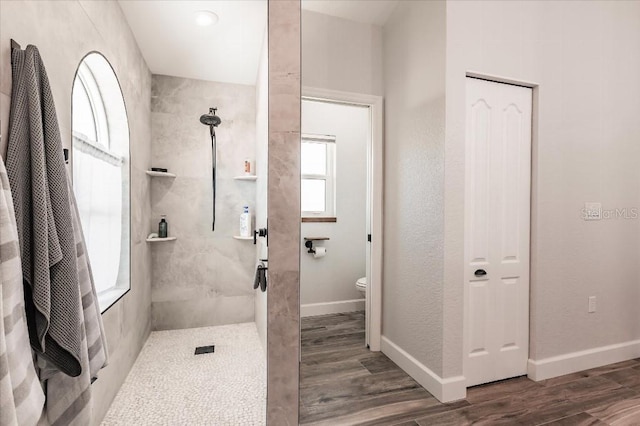 20 Bunker Ter, Rotonda West, FL 33947 - bathroom featuring a walk in shower and wood finished floors