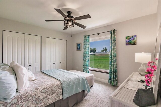 20 Bunker Ter, Rotonda West, FL 33947 - bedroom featuring two closets, carpet flooring, and ceiling fan