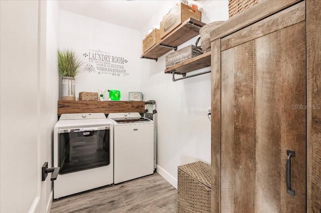 20 Bunker Ter, Rotonda West, FL 33947 - laundry area featuring washing machine and dryer and light wood finished floors