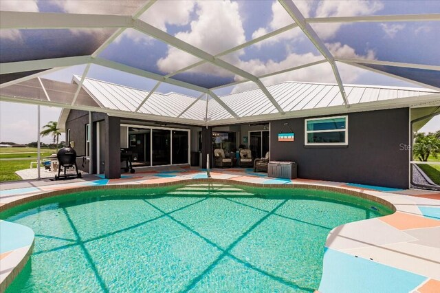20 Bunker Ter, Rotonda West, FL 33947 - swimming pool featuring grilling area, a patio, and glass enclosure