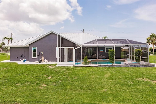 20 Bunker Ter, Rotonda West, FL 33947 - back of house featuring a lawn, an outdoor pool, a standing seam roof, a metal roof, and a lanai