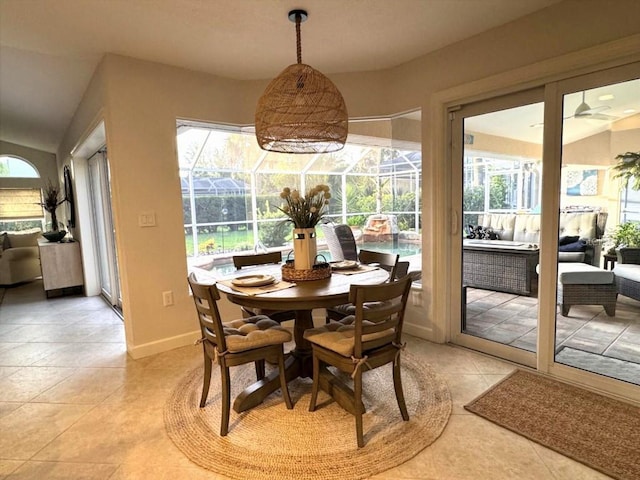 1060 Harbour Wood Dr, Punta Gorda, FL 33983 - dining area featuring healthy amount of natural light, a sunroom, ceiling fan, light tile patterned floors, and lofted ceiling