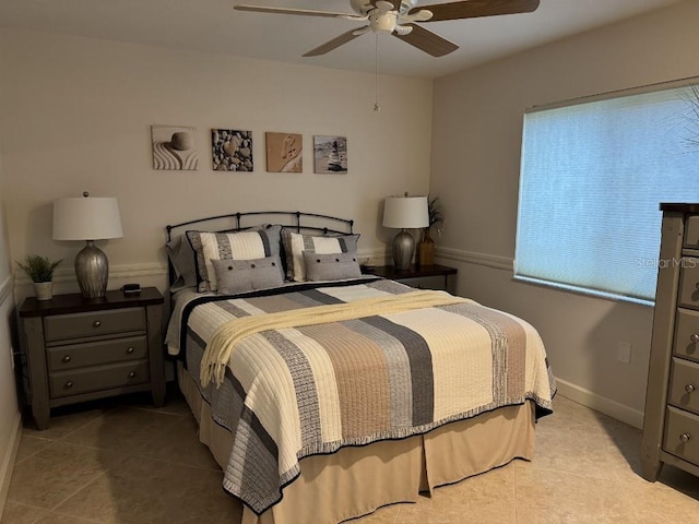 1060 Harbour Wood Dr, Punta Gorda, FL 33983 - tiled bedroom with a ceiling fan and baseboards