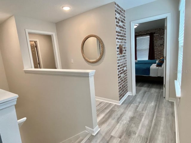 1547 Carey Palm Cir, Kissimmee, FL 34747 - hall with light wood-type flooring and an upstairs landing
