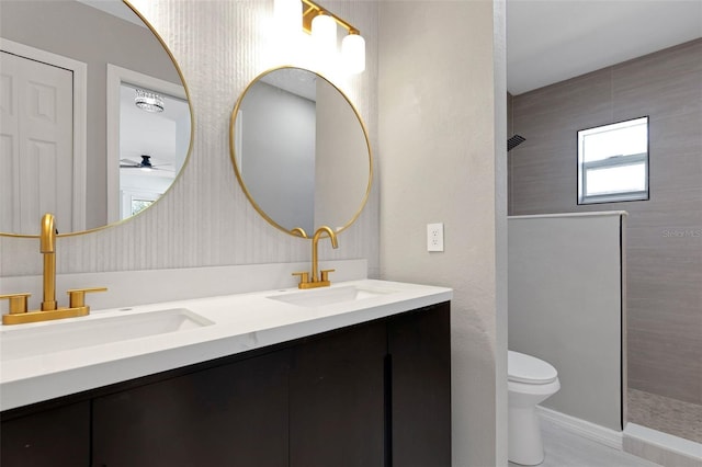 4957 N Cranberry Blvd, North Port, FL 34286 - bathroom featuring double vanity, a tile shower, and ceiling fan