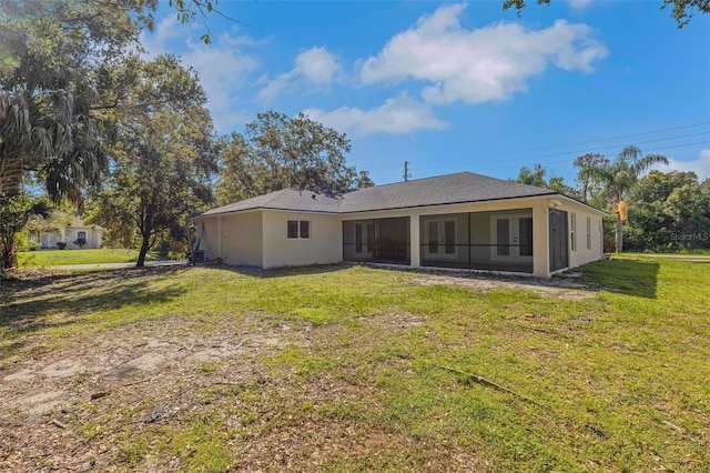 4957 N Cranberry Blvd, North Port, FL 34286 - rear view of house featuring french doors, a yard, and stucco siding